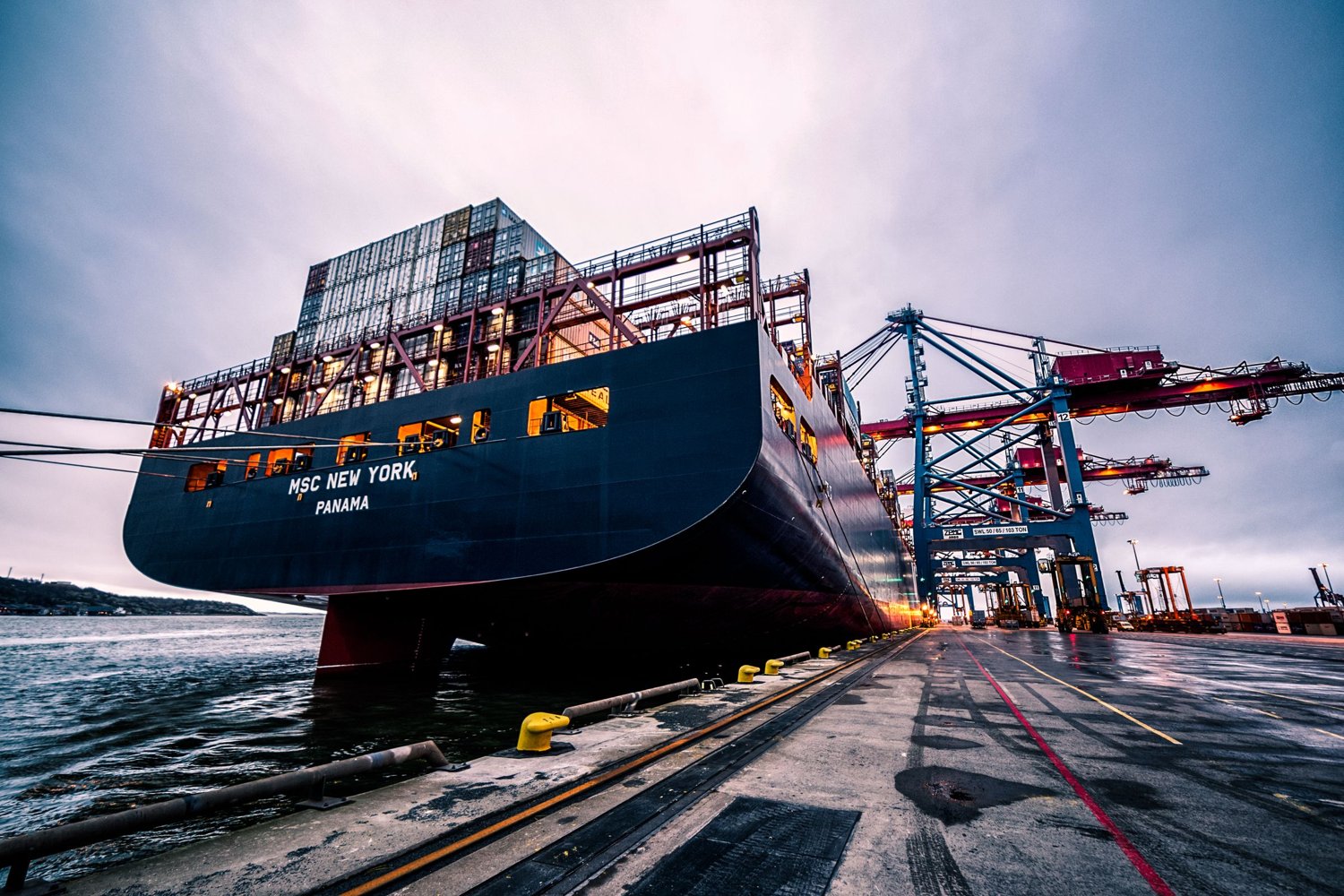 Container ship and cranes at an international shipping port